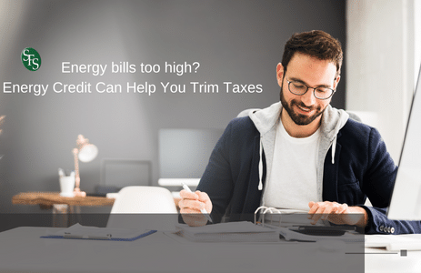 Energy Credit Can Help You Trim Taxes - Image of man at desk