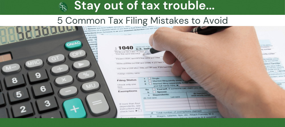 Hand filling out 104-Stay Out of Tax Trouble By Avoiding These 5 Common Tax Filing Mistakes